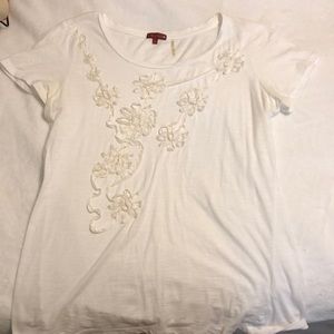 white shirt with white flower detailing
